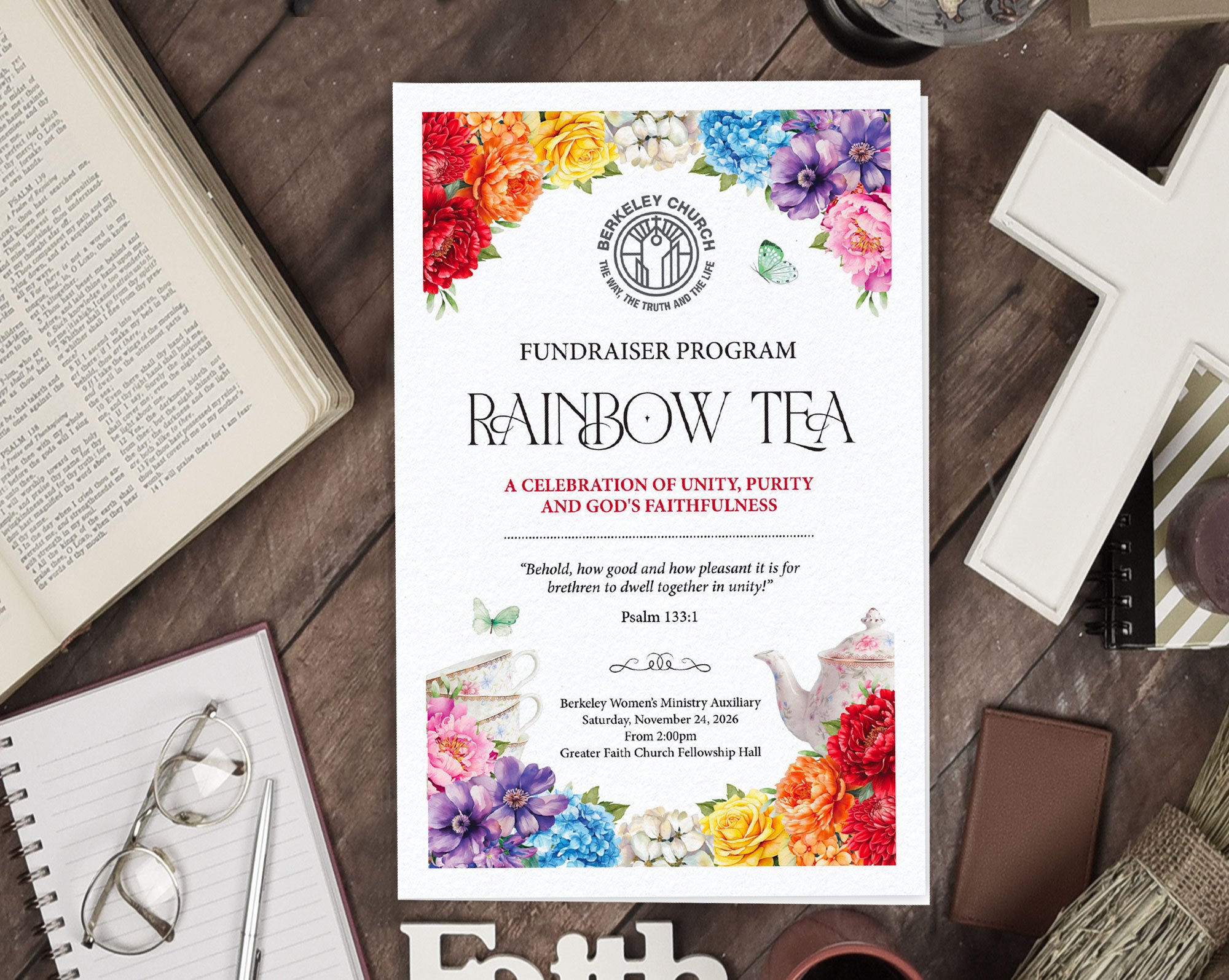 A fundraiser program card for 'Rainbow Tea' by Berkeley Church Ministry Auxiliary, styled in a flat lay on a dark wooden table surrounded by an open Bible, glasses, a notebook, a pen, and a white cross.