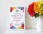 a program for a church rainbow tea on a shelf, leaning up against a white wall next to a white vase with rainbow colored hydrangeas
