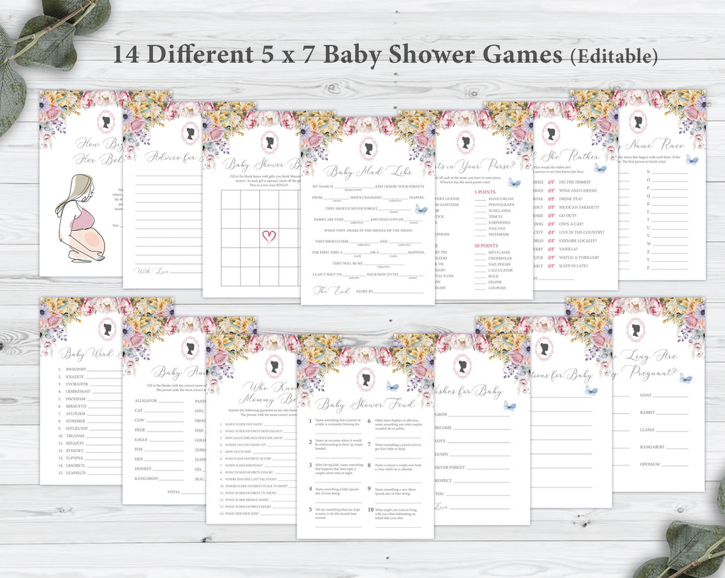 14 different baby shower game cards in two rows laying on a grey wooden background next to some eucalyptus leaves