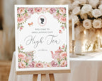 Decorative Bridgerton Inspired sign for a high tea event with floral design and text on an easel.
