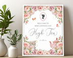 Decorative framed welcome sign poster for a high tea event with floral design and text oleaning on a wall.