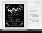 A framed Halloween-themed sign with white decorative text on a black background, shown in a white frame against a light gray wall. To the right, text lists sign size 18 x 20 inches, print at a local print shop, and purchase/download/print today.