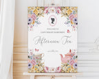 an easel with a Decorative sign for an afternoon tea event with flowers, cameo and teapot illustration.