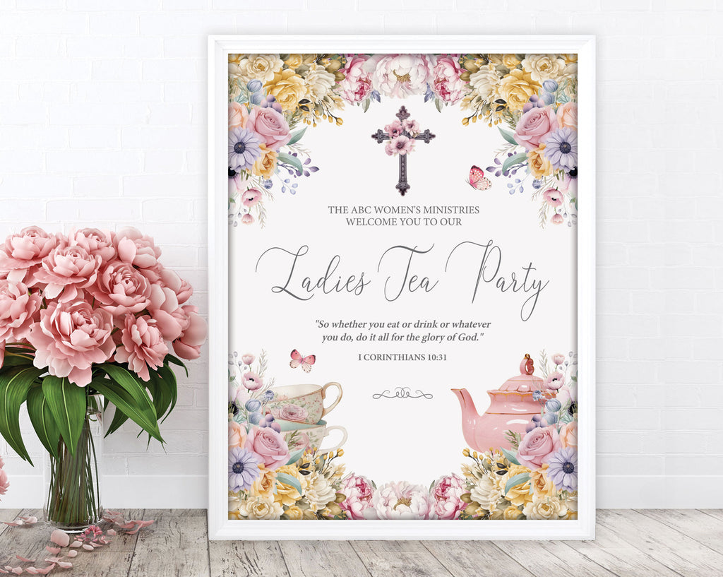 a elegant pastel ladies tea party welcome sign in a white frame leaning up against a white wall next to some pink flowers in a vase