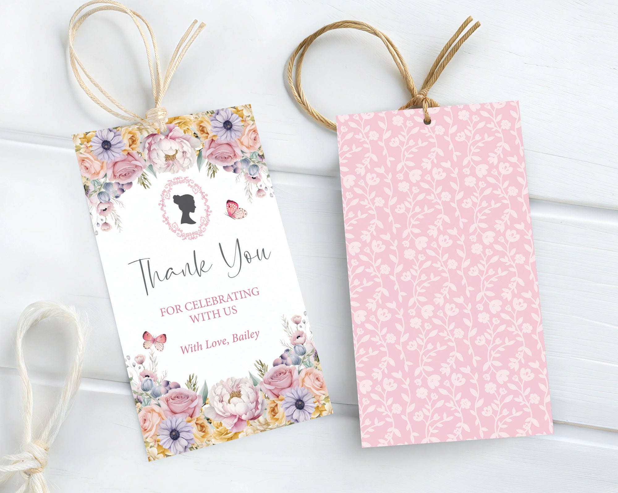 Floral-themed favour card with decorative ribbons on a white background