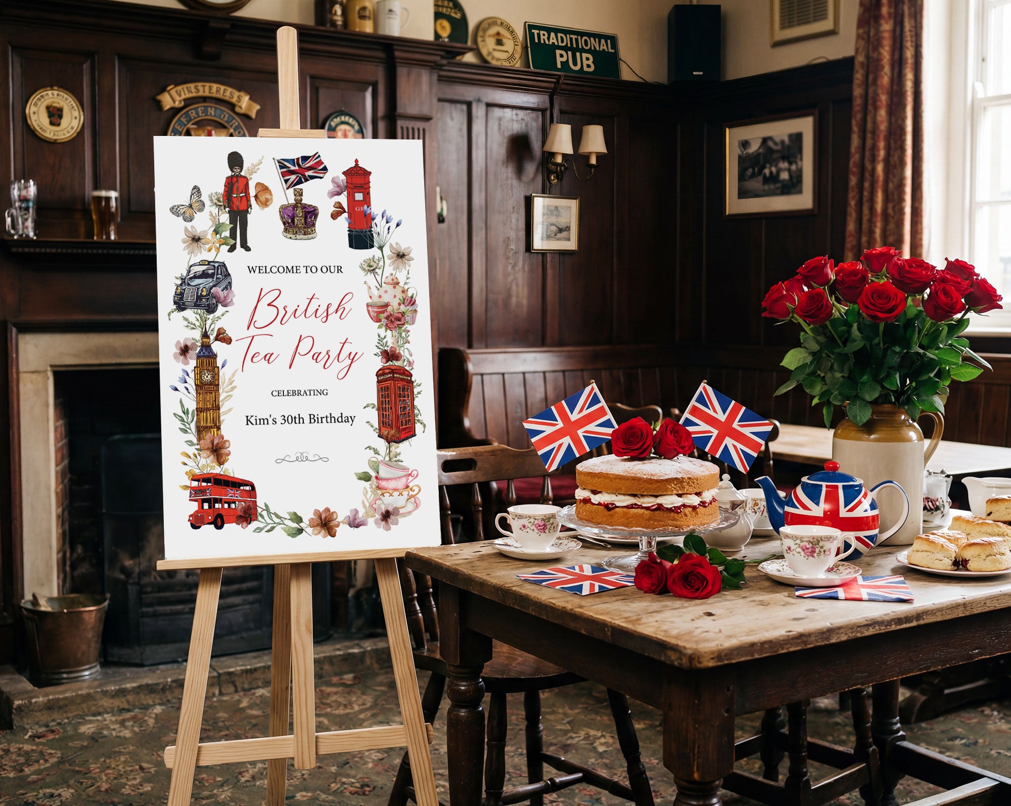 a 24 x 36 british tea party welcome sign next to a wooden table with tea party food, flags and red roses in a pub room
