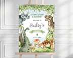 a dinosaur welcome sign for a kids party on an easel in front of a white panel wall
