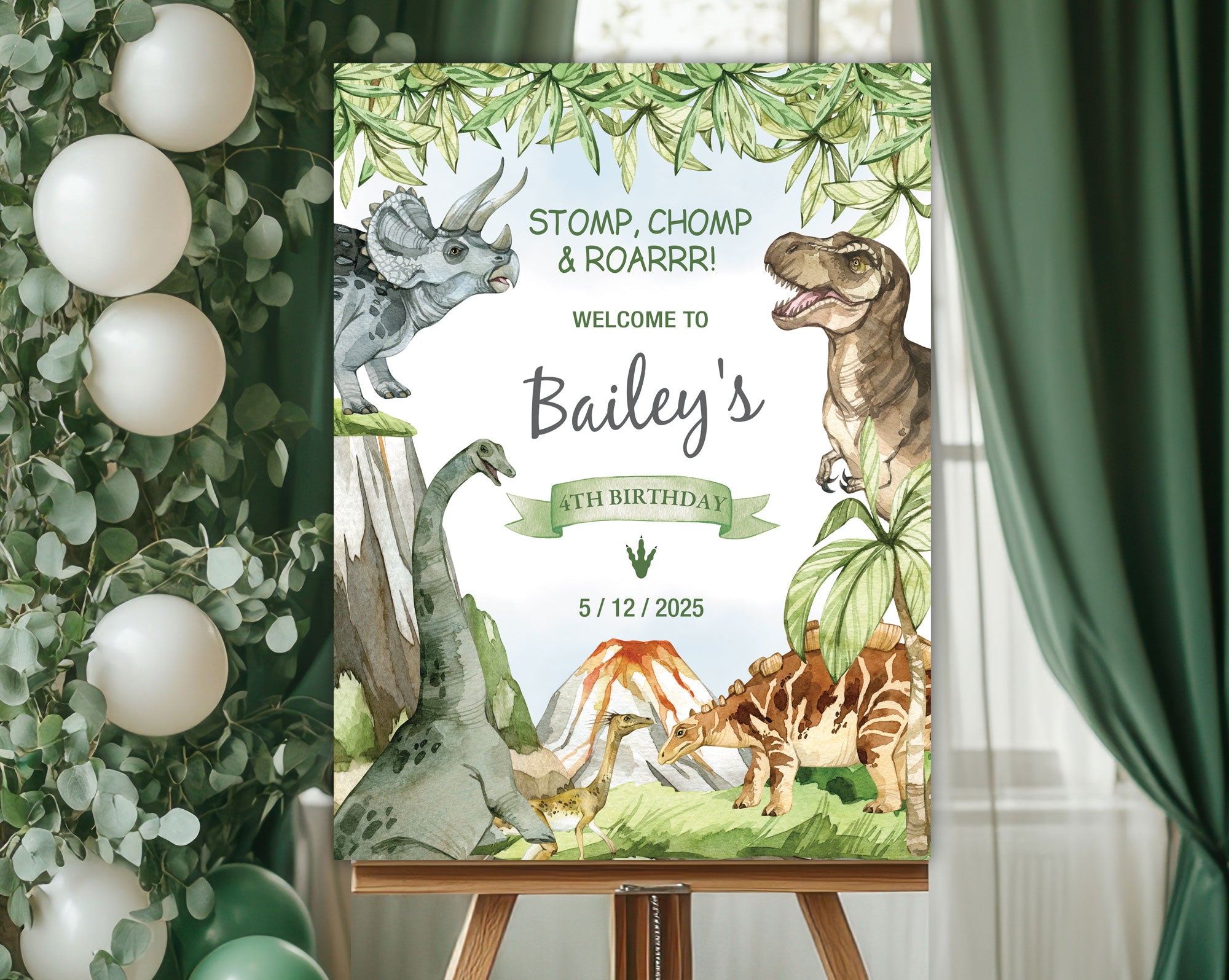 24 x 36 dinosaur and volcano party welcome sign on an easeal in front of a window with green curtains and some greenery with white balloons