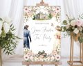 pretty 24 x 36 jane austen party welcome sign with white pink flowers, regency couple, books and mansion graphics on an easel with flowers in the background