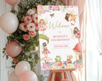 Decorative birthday sign with fairy design, balloons, and flowers on a stand.