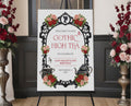 Elegant moody gothic high tea 24 x 36 sign with ornate black frame, gothic teapot, regency style cameo sitting on a black easel with red and pink roses at the side