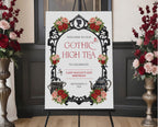 Elegant moody gothic high tea 24 x 36 sign with ornate black frame, gothic teapot, regency style cameo sitting on a black easel with red and pink roses at the side