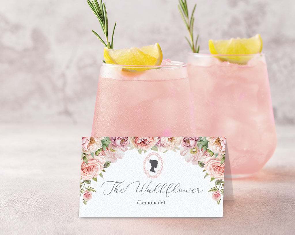 Pink lemonade with rosemary garnish and a decorative label on a light background