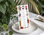 a british tea party menu with various london icon graphics, standing on a white plate on a table with greenery behind it