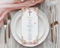 blush pink flower church menu with cross laying on a white plate with gold cutlery