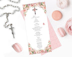 pink flower menu for a church event with cross and pretty pattern back lying on a white background next to a rosary and macarons