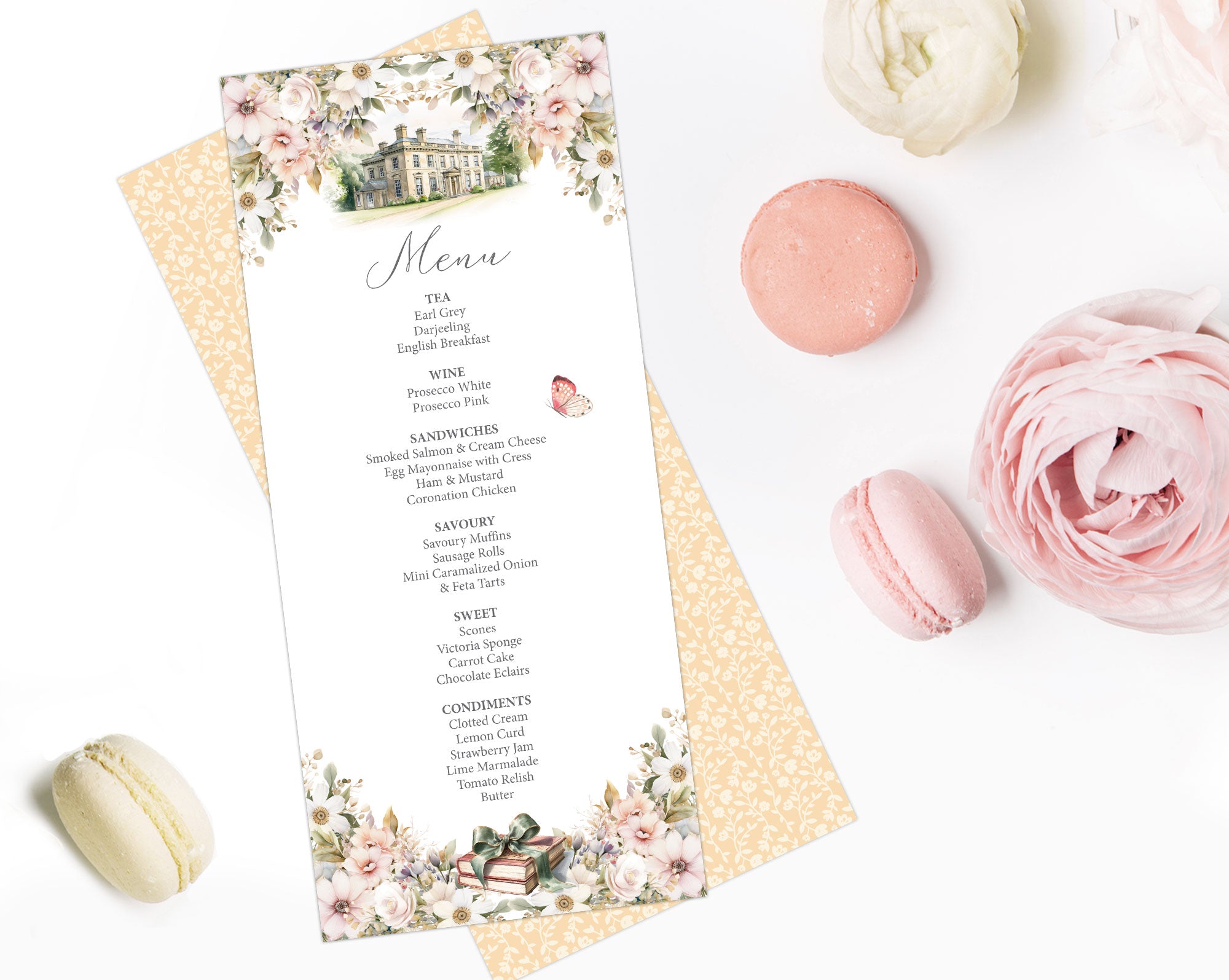 jane austen Menu card with floral design and mansion graphic laying on a white surface with macarons and flowers