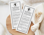 two 'Lady Whistledown's Society graduation Announcement Papers' on a wooden surface with a white fabric background.