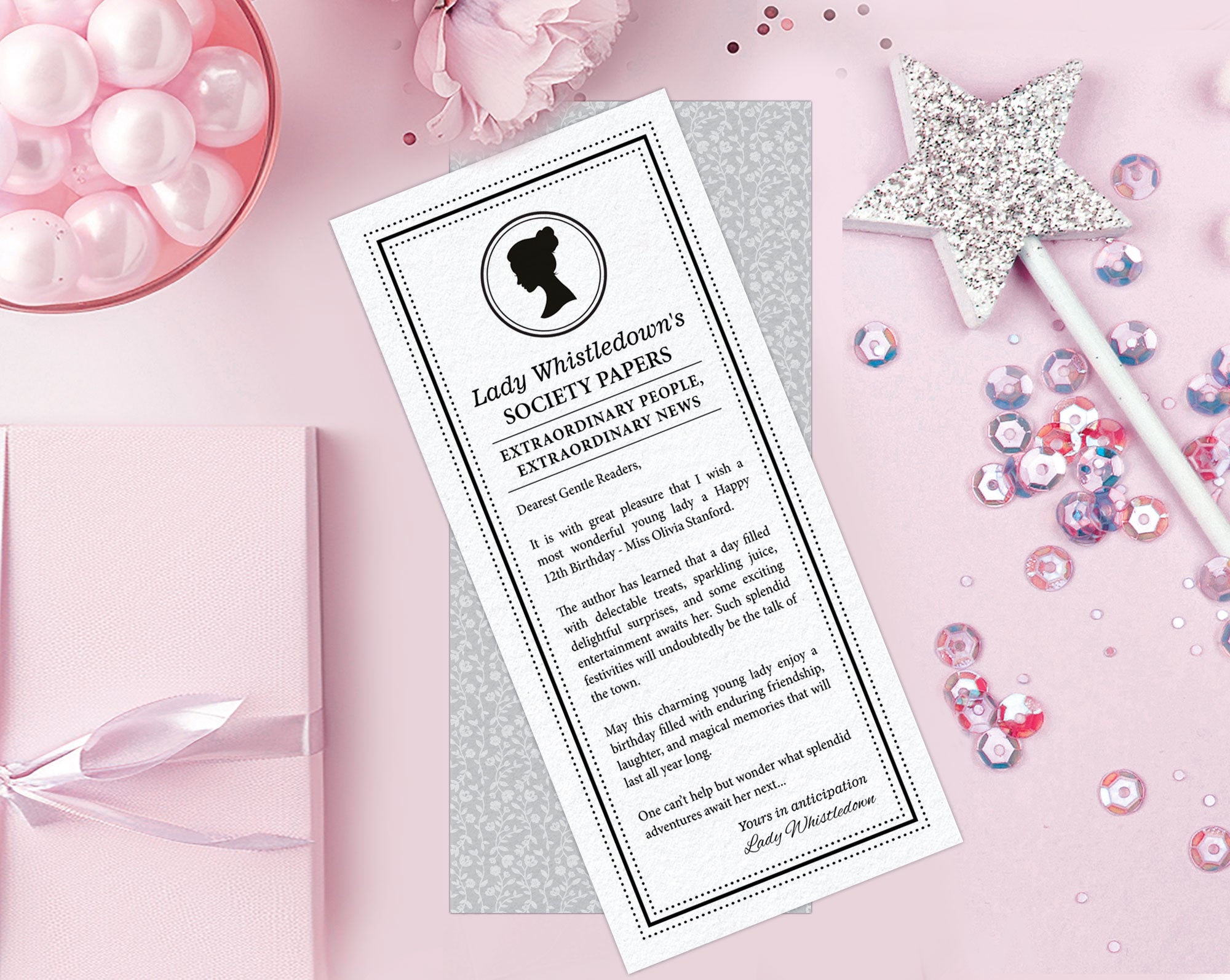 two lady whistledown society notes for a little girls regency birthday with a silver wand, sequins, some pink sweets and a wrapped gift next to it