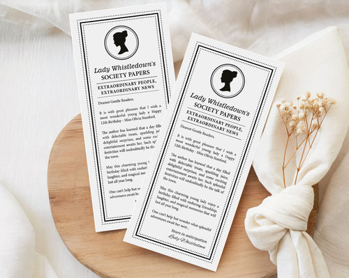 pretty black and white regency style society notice for a little girls Birthday sitting on wooden tray with white muslin cloth and dried flowers