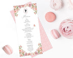 blush pink flower Menu card with cameo design, pink pattern back on a white surface with pink macarons and flowers.