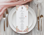 Menu card with blush pink floral and cameo design on a white plate with cutlery