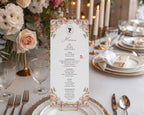 Wedding reception table setting with blush pink floral menu card with cameo