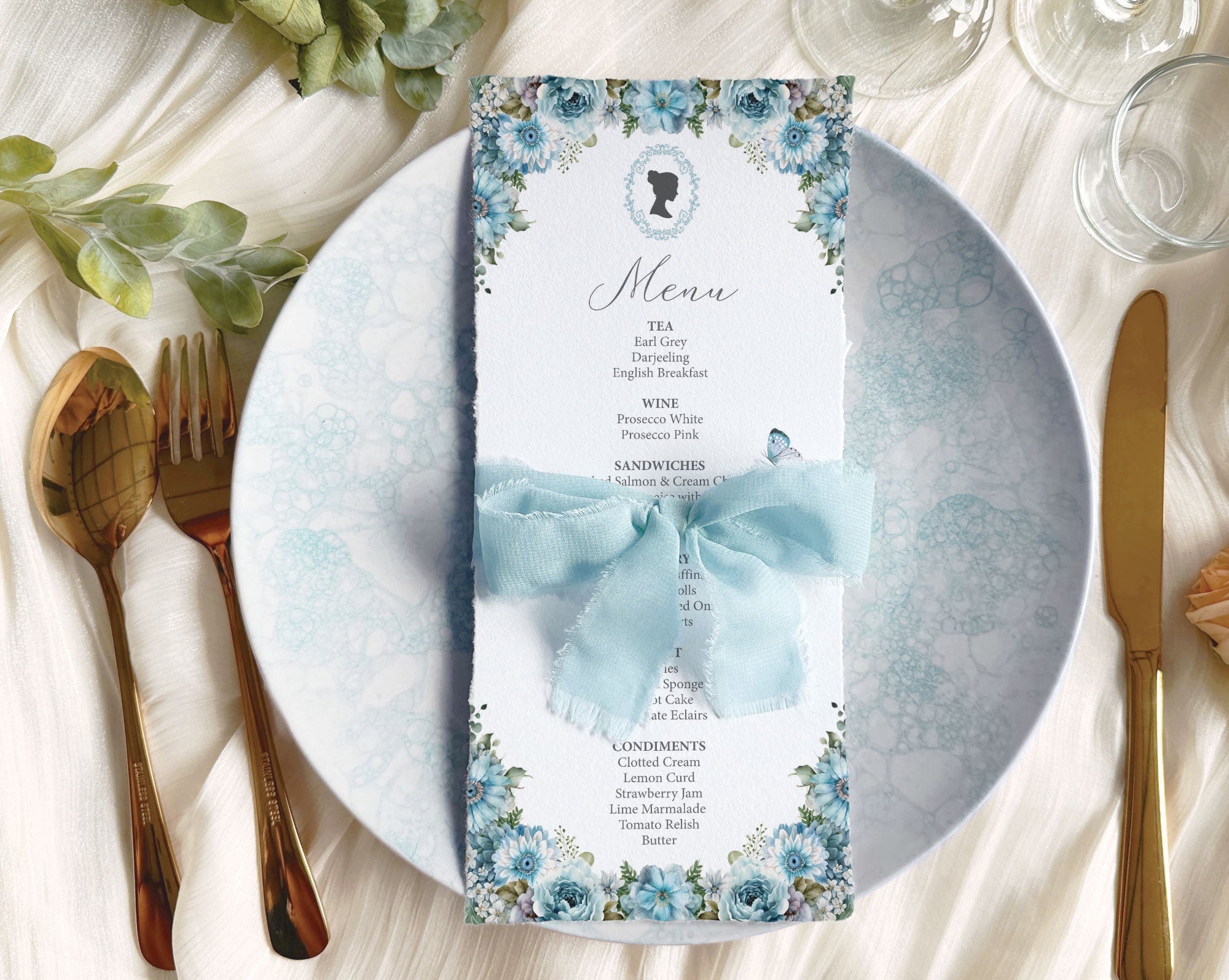 Blue tea menu with regency cameo on a plate wrapped with pretty blue ribbon