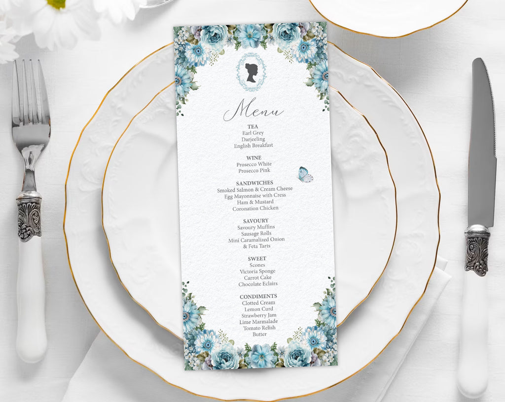 dusty blue flower, regency style menu laying on a white plate with cutlery