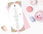 pastel macarons around a pastel flower regency style menu
