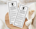 Two baby shower pregnancy reveal printed pages titled 'Lady Whistledown's Society Papers' on a wooden surface with a white cloth and dried flowers.