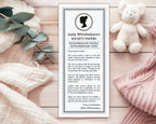 Newspaper with 'Lady Whistledown's Society Papers' on a wooden surface with a teddy bear and eucalyptus leaves.