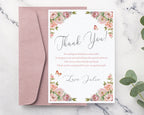 Floral thank you card with pink envelope on a marble surface