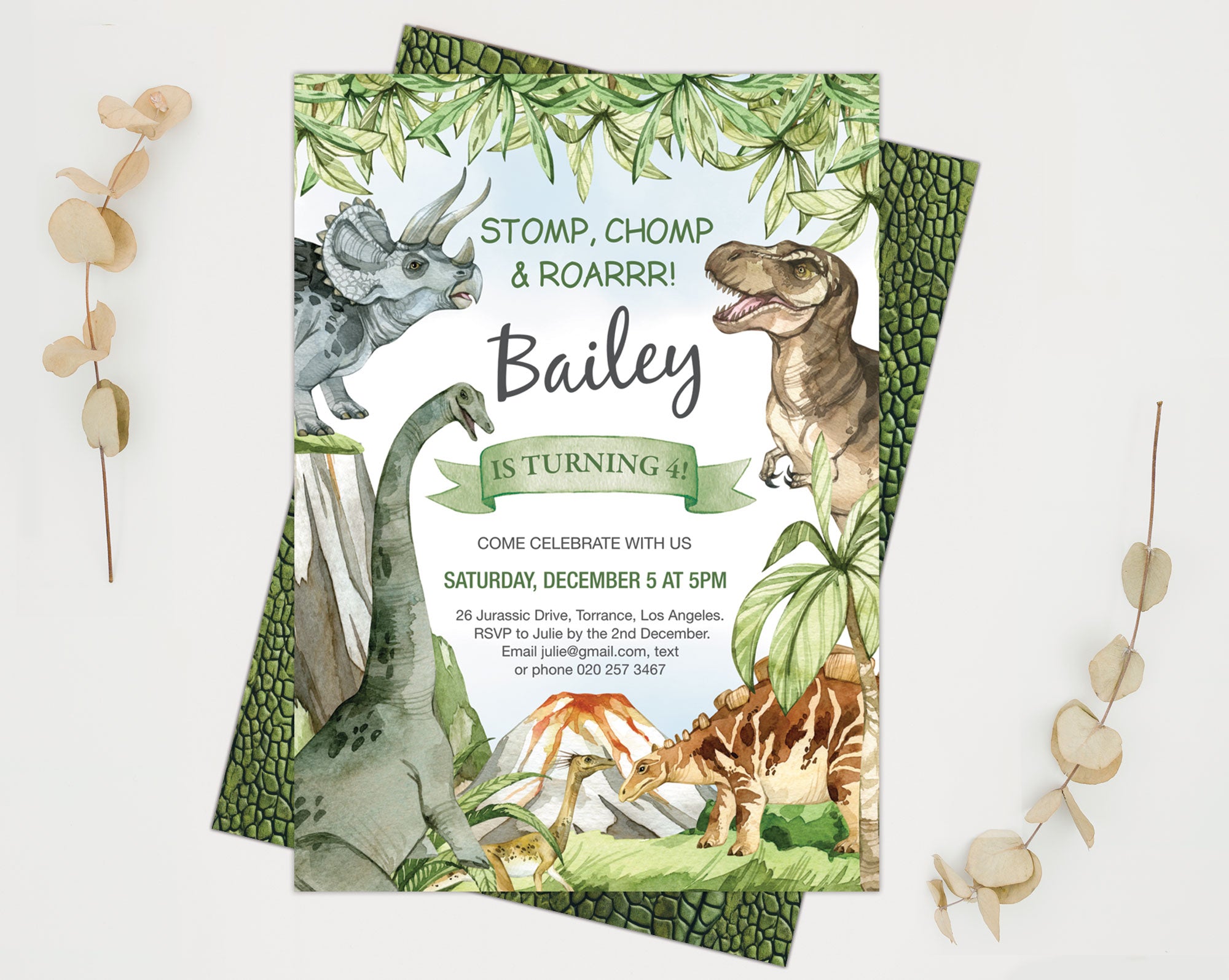 a 5 x 7 dinosaur birthday invitation showing the dinosaur skin back with dried leaves