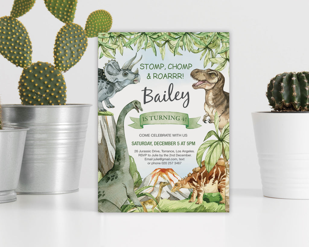Dinosaur-themed birthday invitation leaning against a white wall next to cacti in pots