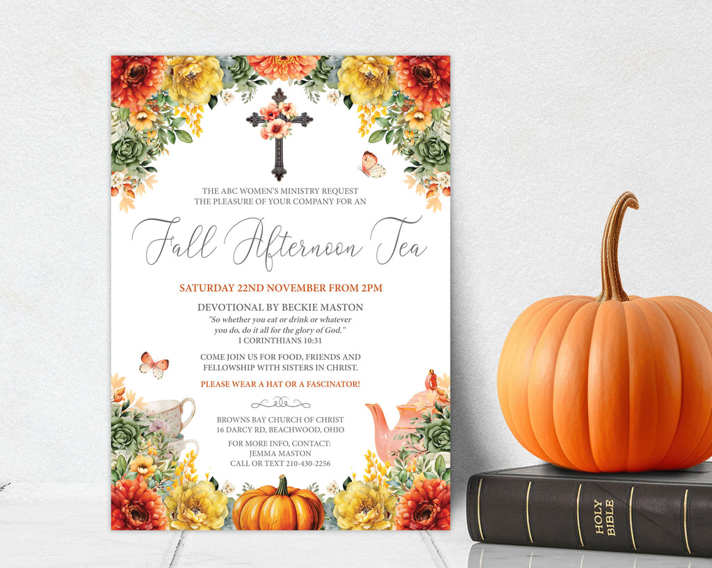 A fall-themed invitation card for an autumn tea event, styled on a white textured background with a large orange pumpkin and a black Bible on a surface below. The card features a white center with elegant script text, surrounded by a colorful border of pumpkins, fall leaves, butterflies, and a cross.
