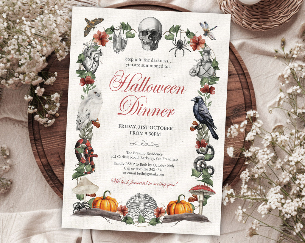 A Halloween dinner invitation card with a vintage botanical illustration, styled on a rustic wooden tray surrounded by white baby's breath flowers and a wicker basket.