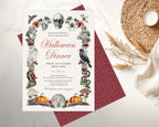 A Halloween dinner invitation card with illustrated seasonal motifs like a skull, owl, spider, raven, pumpkin, and mushrooms, placed on top of another invite showing the patterned burgundy back on a light marble surface with a woven placemat and candle nearby.