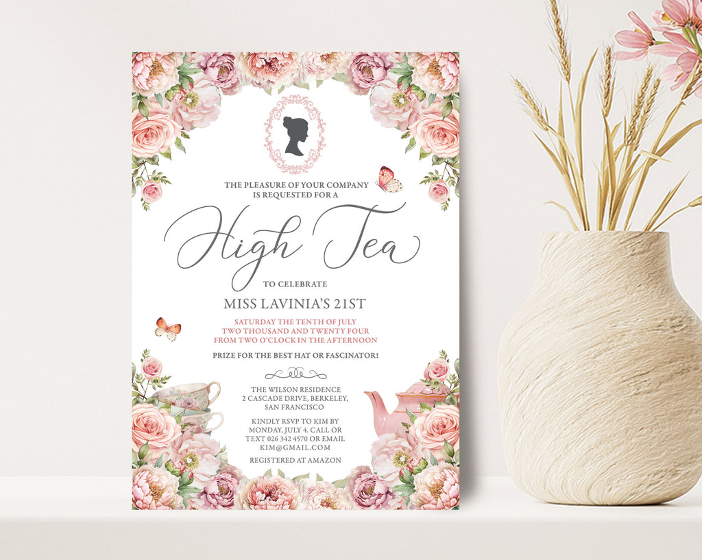 High tea invitation with floral design on a white surface next to a vase with flowers.