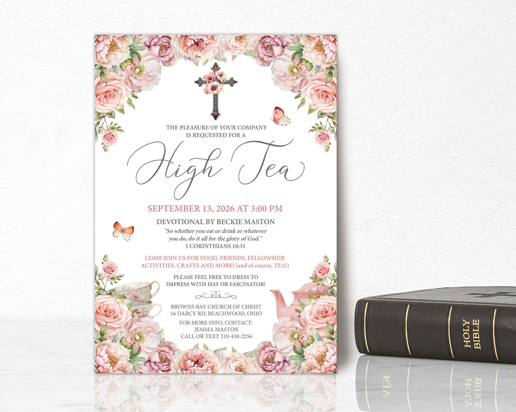 High tea invitation with floral design and cross, placed on a white surface with a Bible below.