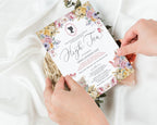 Regency Style Floral invitation card held by hands on a white fabric background