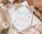 Floral thank you card with envelope on a decorative background