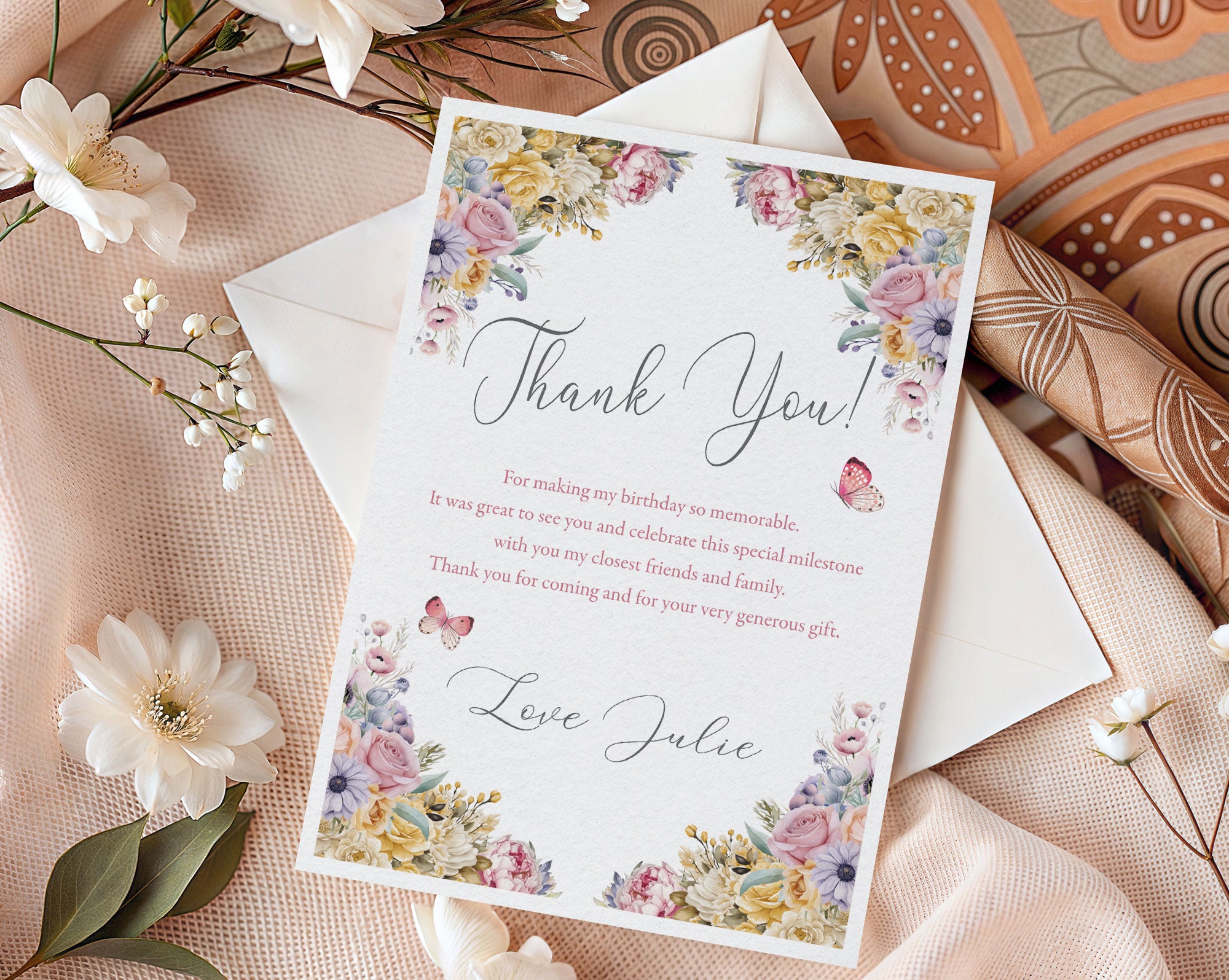 Floral thank you card with envelope on a decorative background