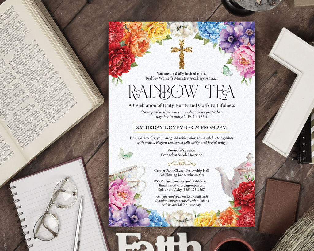 Invitation for a rainbow tea party for a religious event sitting on a dark wood table surrounded by a bible, a cross, eye glasses and notebook