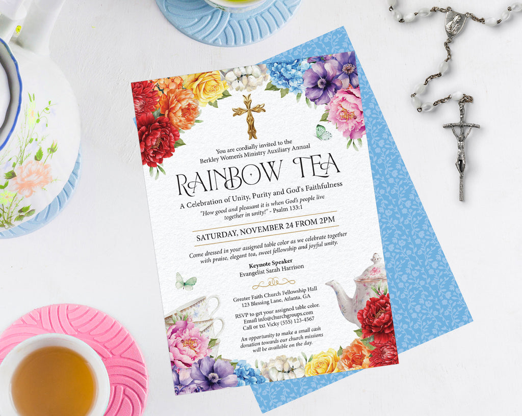 elegant and bright digital download invitation laying on a white table on the blue pattern back, surrounded by a crucifix, tea cups and a teapot