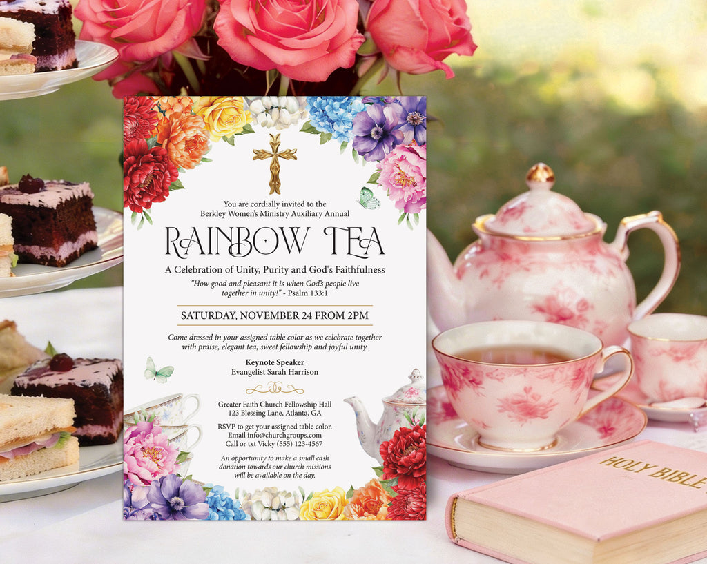 a bright styled women's ministries church rainbow tea invitation on an elegant tea table, leaning against a tiered stand with food, next to a teapot, cups and pink holy bible