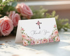 blush pink Floral card with 'Thank You' message and cross design, placed on a surface with pink roses in the background.