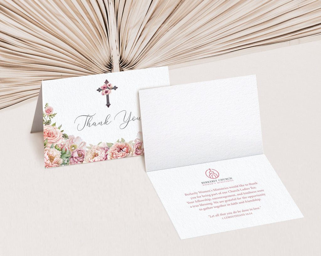blush pink flower Thank you card with floral cross, showing inside text, placed on a textured surface.