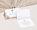 blush pink flower Thank you card with floral cross, showing inside text, placed on a textured surface.