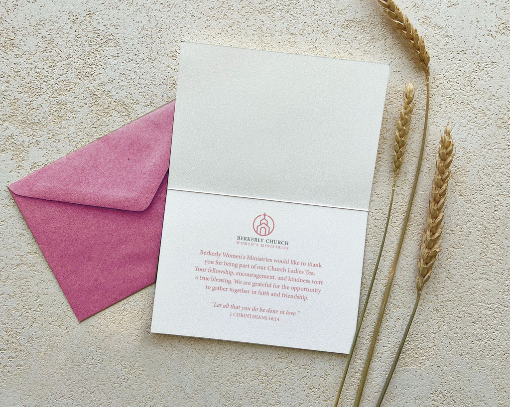religious thank you tent card open showing the inside text next to a pink envelope